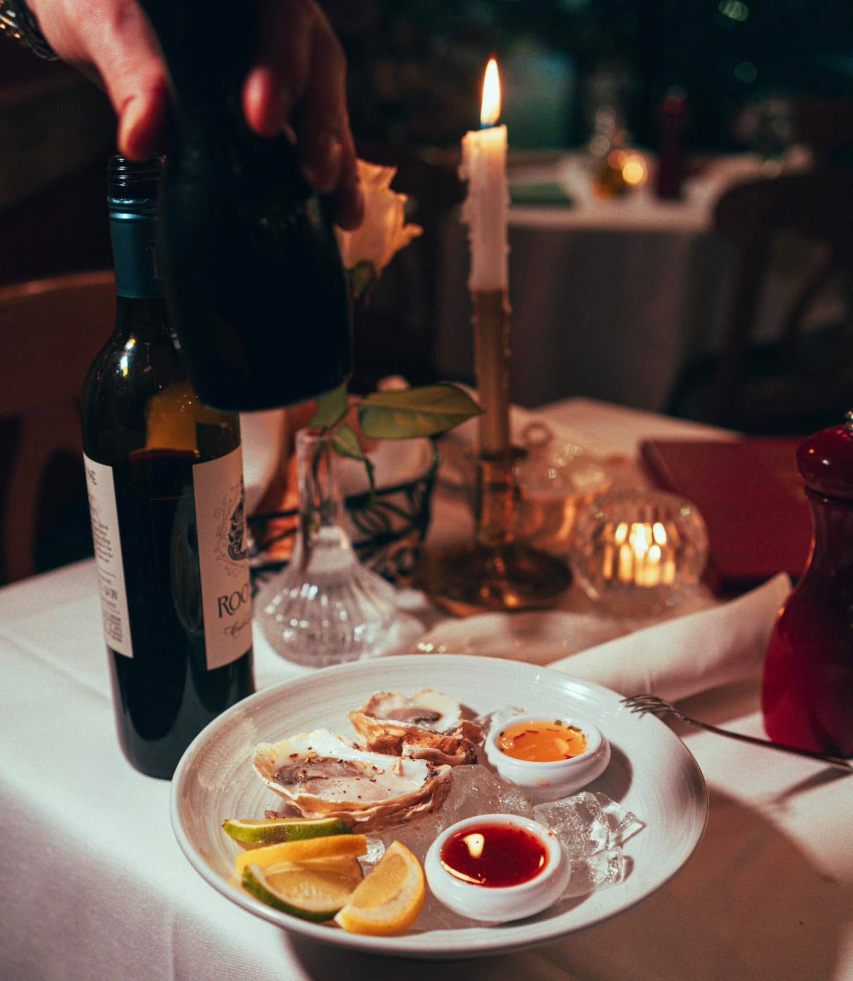 A glass of wine poured tableside